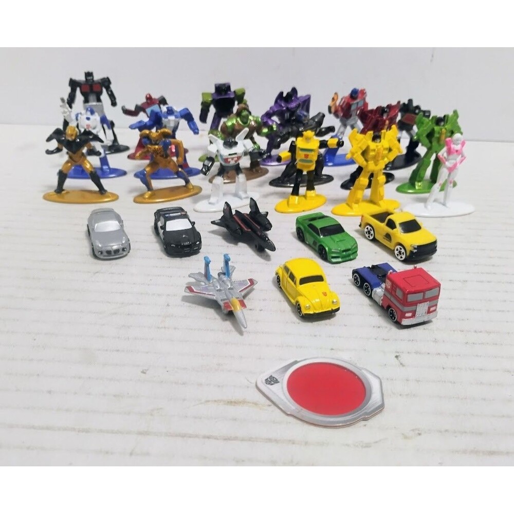 JADA TOYS & JAZWARES HASBRO TRANSFOMERS NANO METALFIGS & VEHICLES LOT 26 PC